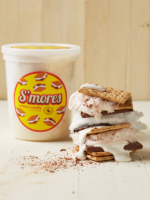 tub of s'mores cotton candy and large stacked s'more layered with chocolate, marshmallow and cotton candy