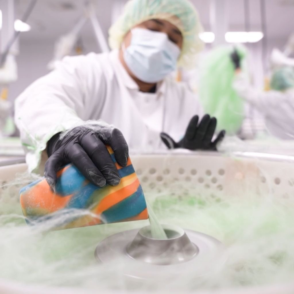 a person making cotton candy